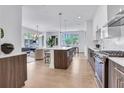 Open concept kitchen with stainless steel appliances and an island with seating at 775 Juniper Ne St # 405, Atlanta, GA 30308