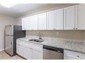 Modern kitchen with white cabinets and stainless steel appliances at 3235 Mcafee Rd, Decatur, GA 30032