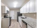 Renovated kitchen featuring modern appliances and granite countertops at 3235 Mcafee Rd, Decatur, GA 30032
