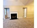 Spacious living room featuring a fireplace and neutral carpeting at 3526 Shepherds Path # 1, Decatur, GA 30034