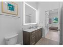 Contemporary bathroom with illuminated mirror and walk-in shower at 775 Juniper Ne St # 103, Atlanta, GA 30308