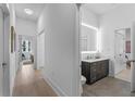 Modern bathroom with sleek vanity, updated fixtures and tile flooring at 775 Juniper Ne St # 103, Atlanta, GA 30308