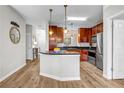 Stylish kitchen featuring a center island, stainless steel appliances, and sleek countertops, with modern lighting fixtures at 401 16Th Nw St # 1376, Atlanta, GA 30363