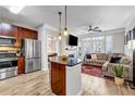 Inviting living space featuring a modern island kitchen open to the living room with a fireplace and balcony access at 401 16Th Nw St # 1376, Atlanta, GA 30363