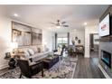 Spacious living area featuring a fireplace and access to a balcony at 3342 Orwell Way # 1405, Cumming, GA 30041