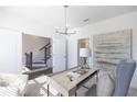 Spacious home office with built-in desk and large art at 5442 Howington Ct # 191, Buford, GA 30518