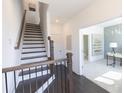 Elegant staircase leading to upper level at 5442 Howington Ct # 191, Buford, GA 30518