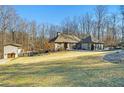 House with detached garage and expansive backyard at 201 Windflower Ct, Canton, GA 30115