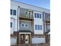 Townhome exterior showing a small balcony above the garage door, and multi-pane windows at 4213 Legacy Ln # 32, Acworth, GA 30101