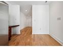 Modern entryway with hardwood floors and neutral colors at 44 Peachtree Nw Pl # 1828, Atlanta, GA 30309