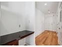 Bright entryway with hardwood floors, built-in desk, and access to other rooms at 44 Peachtree Nw Pl # 1828, Atlanta, GA 30309