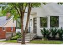 Front entrance of a modern white home with black window frames at 520 Wabash Ne Ave # B, Atlanta, GA 30312
