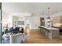 Open concept living space with modern kitchen and hardwood floors at 520 Wabash Ne Ave # B, Atlanta, GA 30312