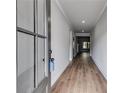Inviting hallway with hardwood floors that lead to the living area at 8971 Callaway Dr, Winston, GA 30187