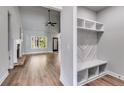 Open living area featuring a stone fireplace, custom shelving, and mudroom at 8971 Callaway Dr, Winston, GA 30187