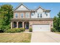 Two-story house with stone accents and a landscaped yard at 520 Andes Ln, Canton, GA 30114