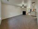 Spacious living room featuring a fireplace and neutral carpeting at 720 Crestwell Sw Cir, Atlanta, GA 30331