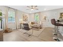 Open living space with hardwood floors, sectional sofa, and access to kitchen at 2060 Westwood Ave, Atlanta, GA 30310