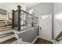Entryway with staircase, hardwood floors, and a white door at 2671 Willow Field Se Xing # 14, Marietta, GA 30067