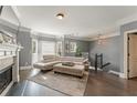Spacious living room with hardwood floors, fireplace, and large windows at 2671 Willow Field Se Xing # 14, Marietta, GA 30067