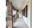 Covered porch showing brick columns and a view of the yard at 40 Chimney Rise Ct, Stockbridge, GA 30281