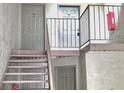 Interior condo building stairwell with access to multiple units at 224 Seasons Pkwy, Norcross, GA 30093