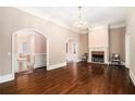 Spacious living room with hardwood floors, fireplace, and arched doorways at 159 Cedar Creek Rd, Cartersville, GA 30121