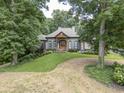 Gorgeous home featuring professional landscaping, beautiful facade, and a welcoming entrance at 416 Spring Place Ne Rd, White, GA 30184