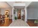 Grand foyer with high ceilings, tile entryway, hardwood flooring, and views into the kitchen and living areas at 814 Sunny Field Ln, Lawrenceville, GA 30043