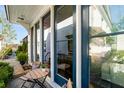 Cozy front porch seating area with views of the neighborhood and large windows at 2057 Telfair Cir, Atlanta, GA 30324