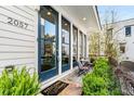 Inviting front porch with a 'Welcome' mat, seating area, and large windows at 2057 Telfair Cir, Atlanta, GA 30324
