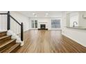 Spacious living room with hardwood floors, fireplace, and access to deck at 502 Bridge Se Ln, Smyrna, GA 30082