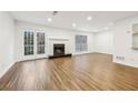 Bright living room with hardwood floors, fireplace and French doors at 502 Bridge Se Ln, Smyrna, GA 30082