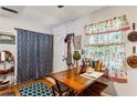 Kitchen dining area with wood table and chairs at 792 Plainville Sw Cir, Atlanta, GA 30331
