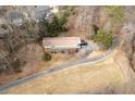 House nestled on a wooded lot with a long private drive at 1036 Wooten Lake Nw Rd, Kennesaw, GA 30144