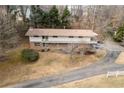 Two-story home with a private drive and wooded lot at 1036 Wooten Lake Nw Rd, Kennesaw, GA 30144