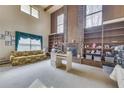 Spacious living room with a large brick fireplace and built-in shelving at 1036 Wooten Lake Nw Rd, Kennesaw, GA 30144