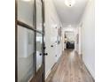 Bright entryway with hardwood floors and view to living room at 1018 Cherry Bark Ln, Loganville, GA 30096