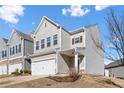 Two-story home with gray siding, white garage door, and landscaping at 38 Rocky Knl, Dallas, GA 30157