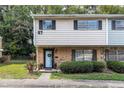 Brick front of charming townhome with small yard and trees at 4701 Flat Shoals Rd # 57A, Union City, GA 30291