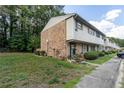 Townhome's side view, showcasing brick and siding at 4701 Flat Shoals Rd # 57A, Union City, GA 30291