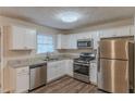 Modern kitchen with stainless steel appliances and granite countertops at 404 Utoy Sw Cir, Atlanta, GA 30331
