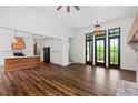 Open living room with hardwood floors, fireplace, and access to backyard at 153 Palisade Dr, Rydal, GA 30171