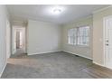 Neutral living room with plush gray carpet, fresh paint, and ample natural light at 2534 Ben Hill Rd, Atlanta, GA 30344