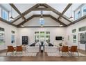Spacious clubhouse interior with high ceilings and comfortable seating at 5330 Memento Trace, Cumming, GA 30040