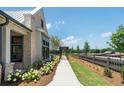 Charming craftsman style home exterior with walkway and landscaping at 5330 Memento Trace, Cumming, GA 30040