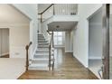 Two-story foyer with hardwood floors, staircase, and balcony at 1400 Cresthaven Ln, Lawrenceville, GA 30043