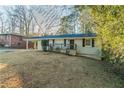 Charming single-story home with a covered carport and a well-maintained front yard at 1927 Cindy Dr, Decatur, GA 30032
