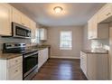 Modern kitchen features stainless steel appliances, granite counters, and ample cabinet space at 1927 Cindy Dr, Decatur, GA 30032