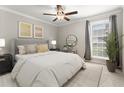 Bright bedroom with ceiling fan and large window at 534 Granville Ct, Atlanta, GA 30328